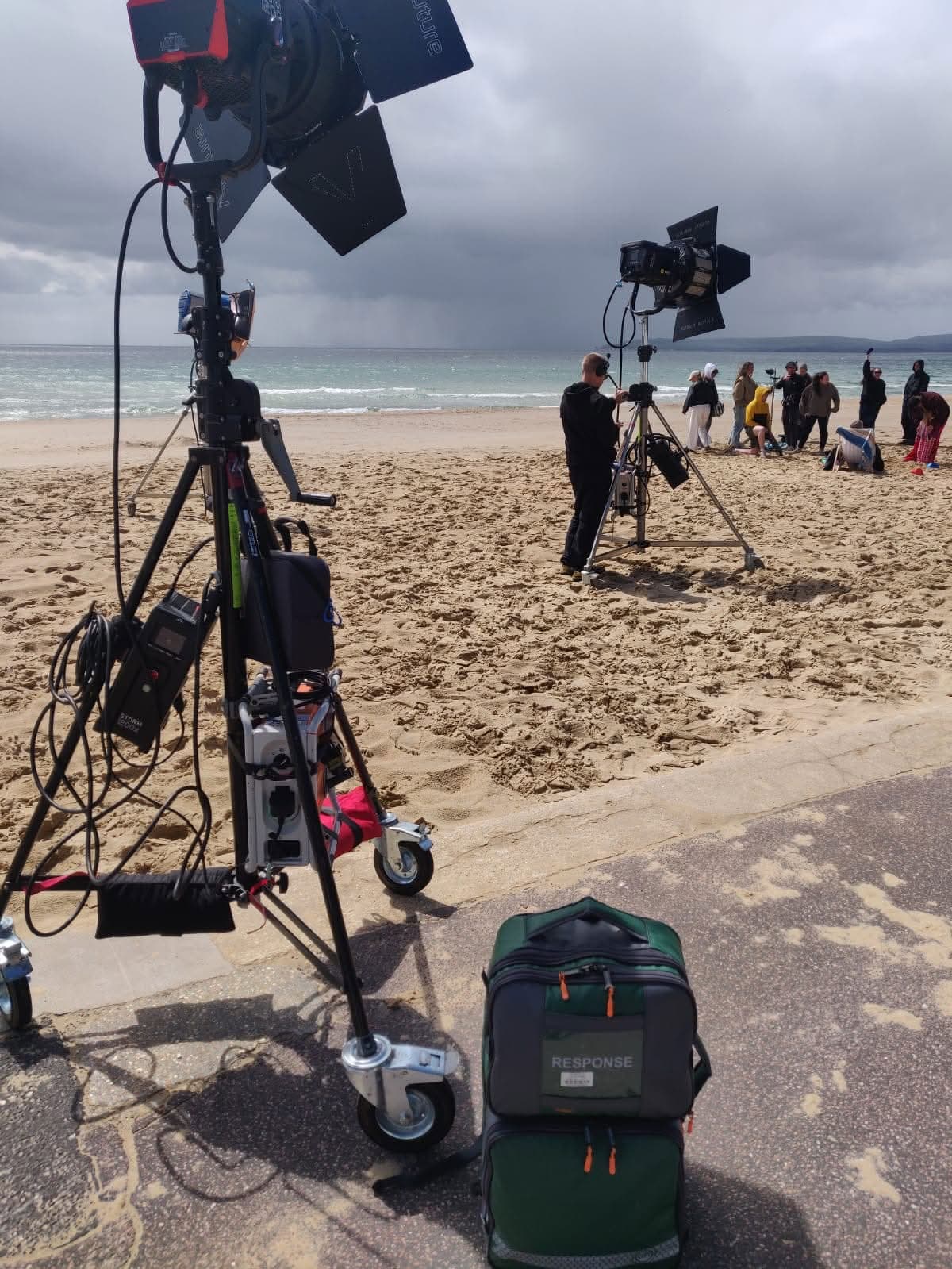 LightMed response medic bag on a beach location shoot beside professional lighting equipment and crew.