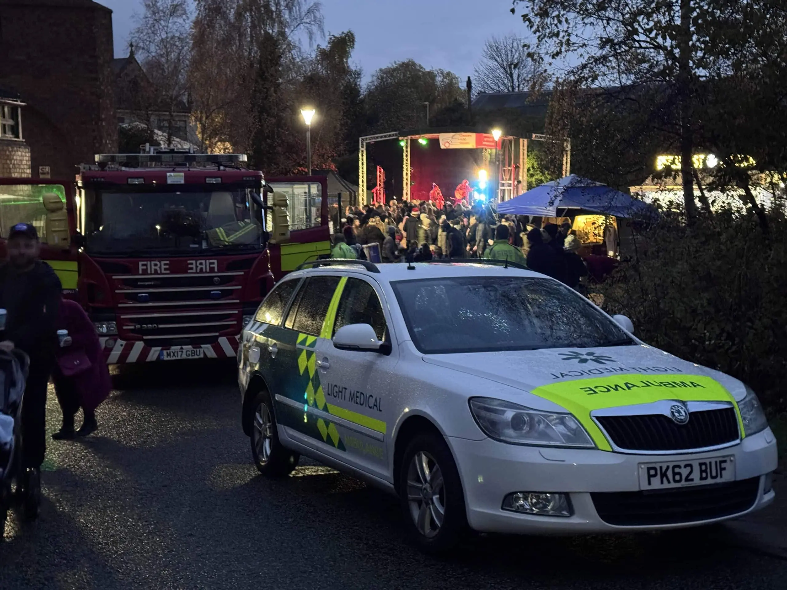 Evening event with medical cover team on site at a larger public gathering.